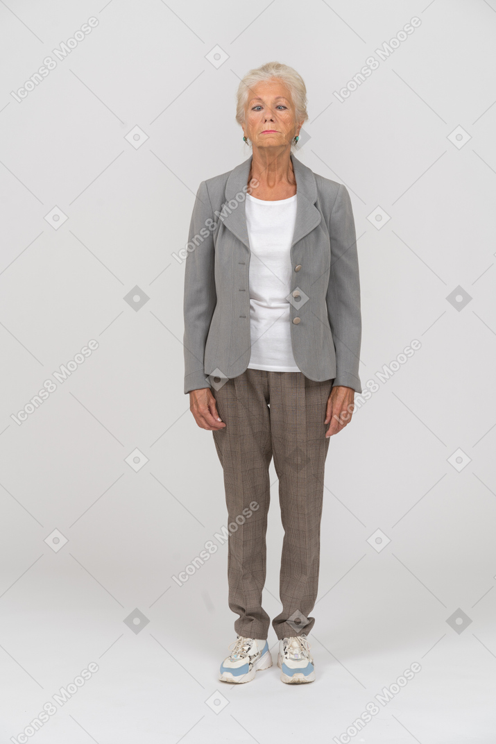 Front view of a beautiful old woman in suit