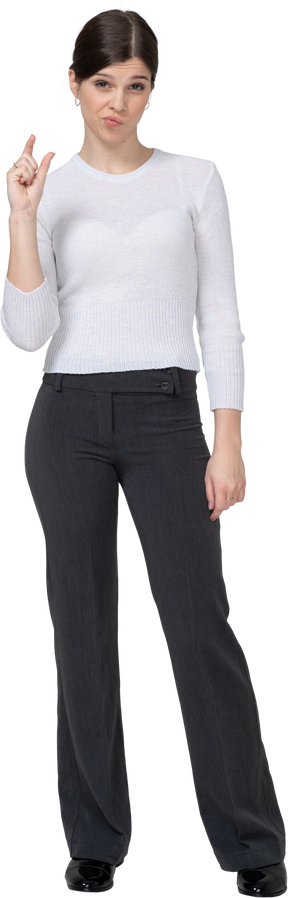 Front view of a young woman in office clothing showing size of something