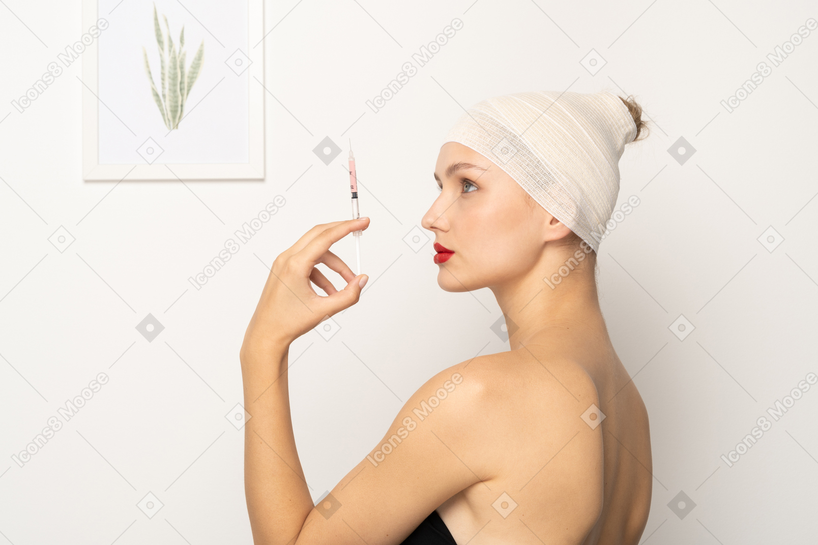 Side view of a young woman holding syringe