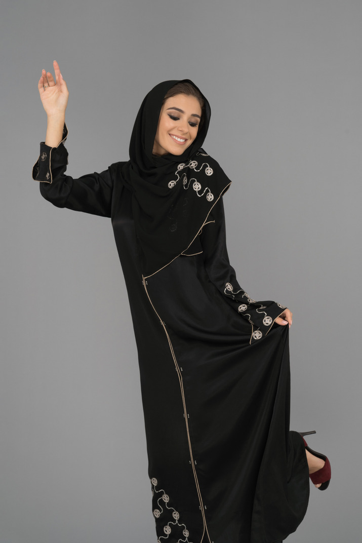 Cheerful arab woman dancing