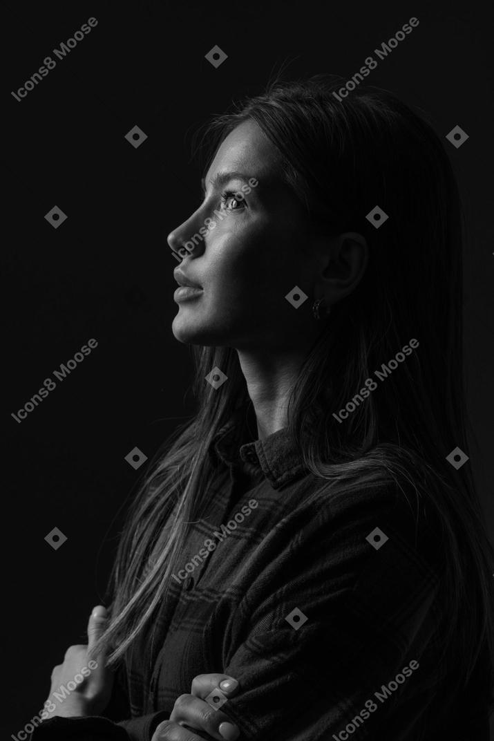 Black and white photo of woman looking up