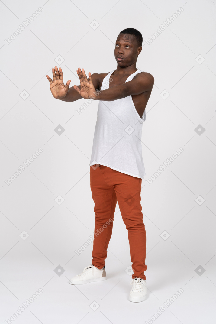 Young man showing a stop gesture with his hands