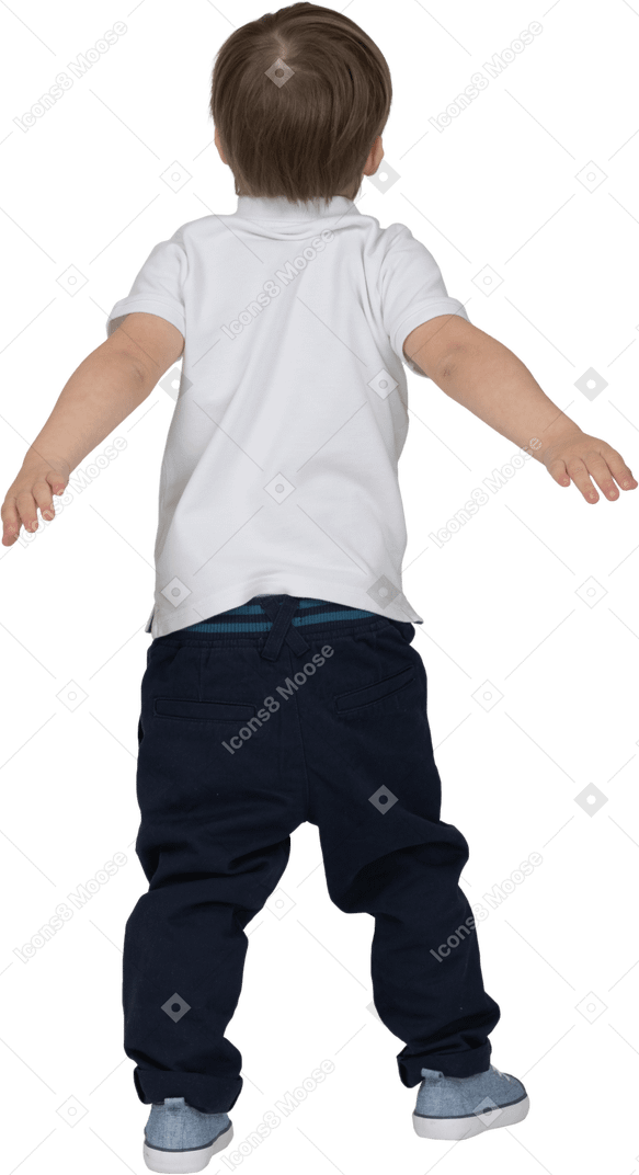 Back view of a boy with hands behind his back