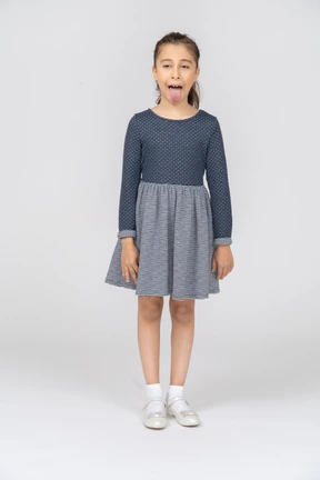 Front view of a girl showing tongue