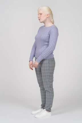 Young woman standing with her eyes closed