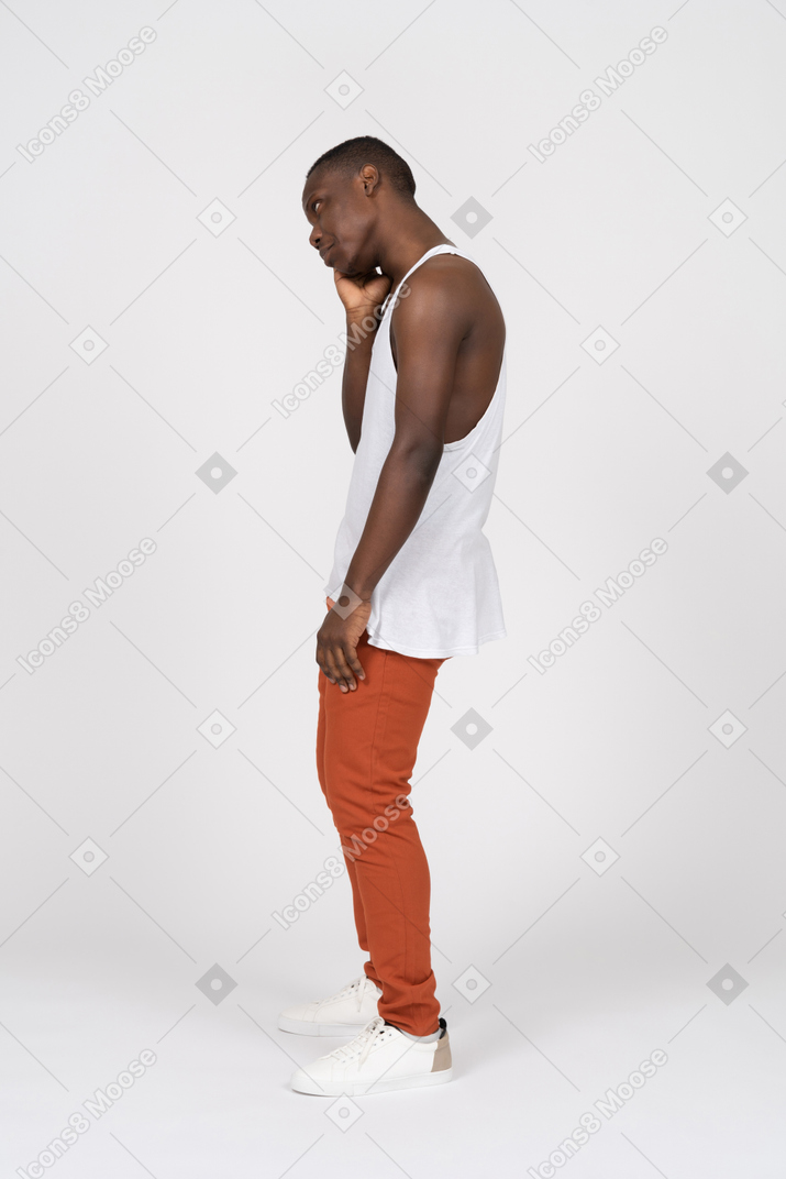 Side view of young man looking sad