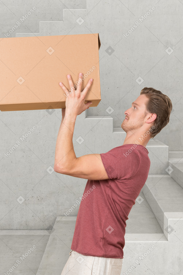 Man carrying a large cardboard box
