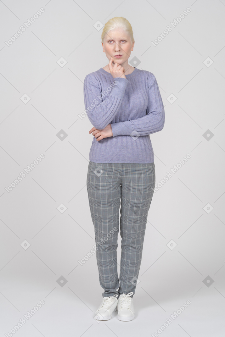 Front view of a woman in casual clothes thinking