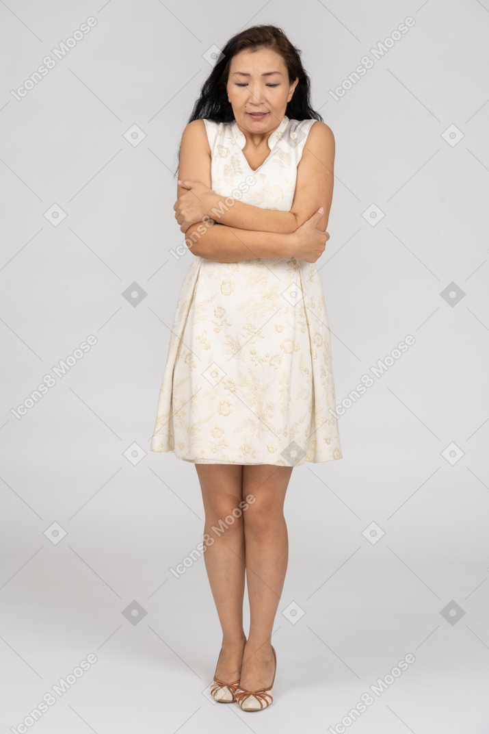 Woman in a white dress standing