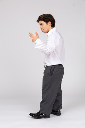 Side view of an office worker showing  three fingers