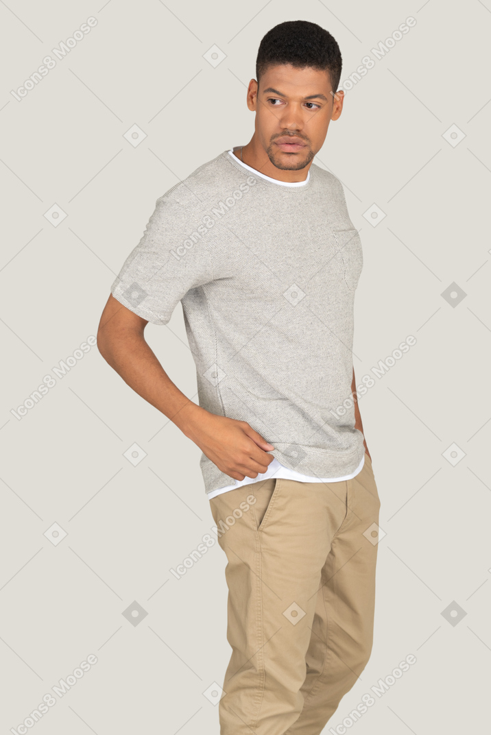 Athletic man posing on the grey background