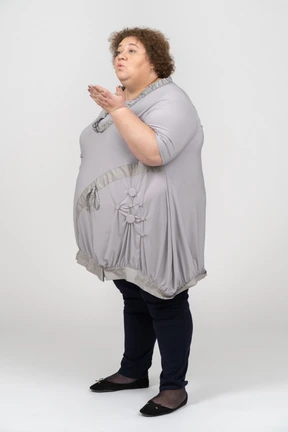 Woman making flying kiss