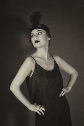 Gorgeous flapper posing in little black dress