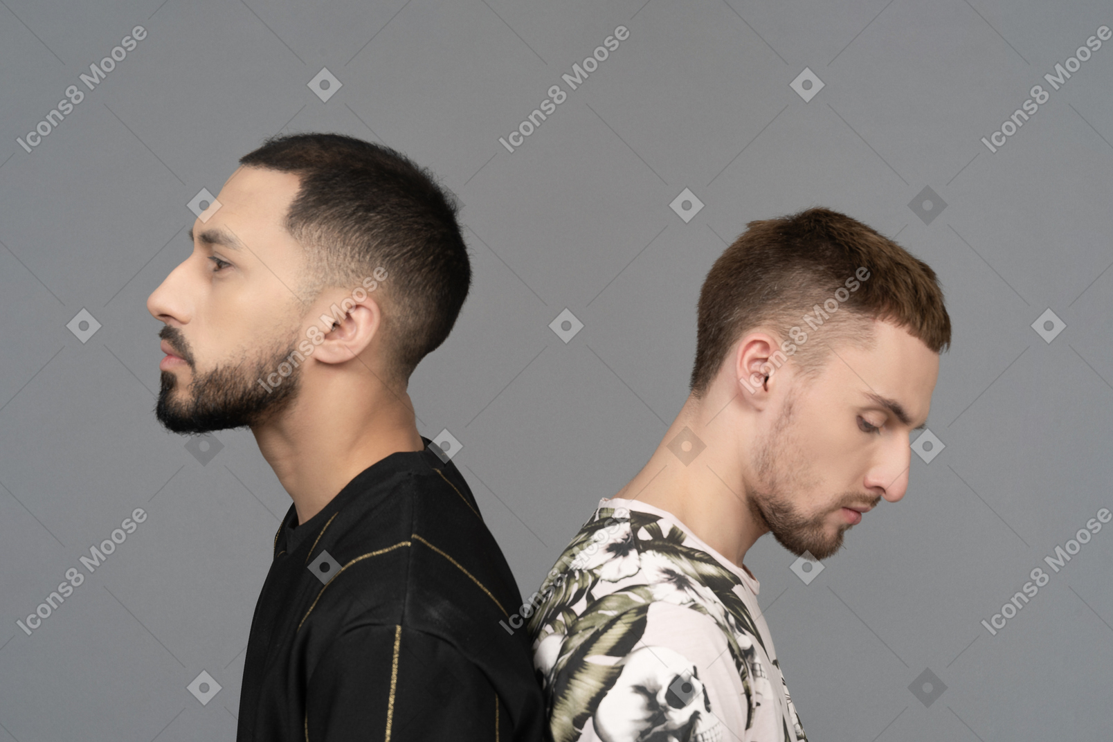 Close-up of a caucasian male couple standing back to back