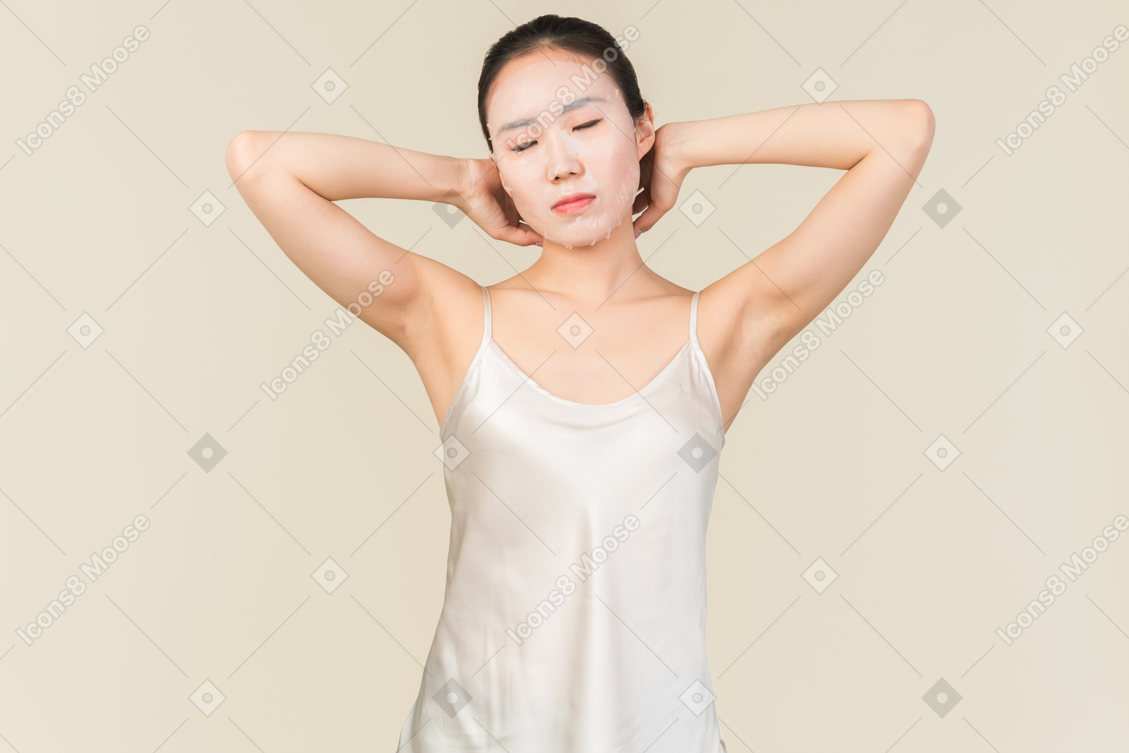 Young asian woman stretching her arms behind the back with eyes closed
