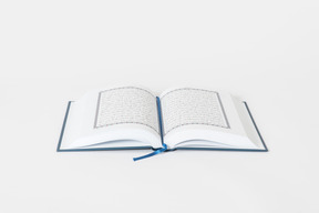 Open koran book on white background