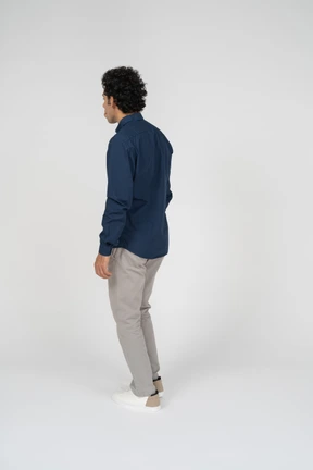 Man in casual clothes standing in profile