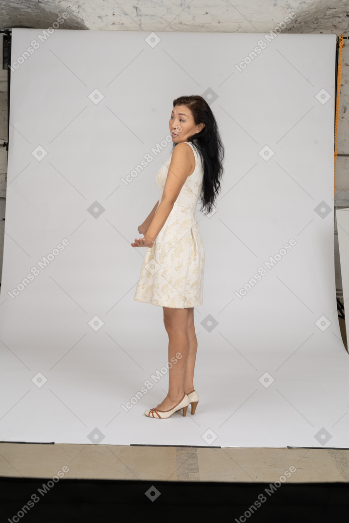 Woman in a white dress standing