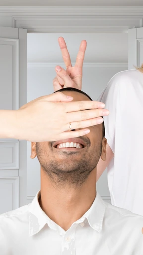 A man with horns and half of his face covered
