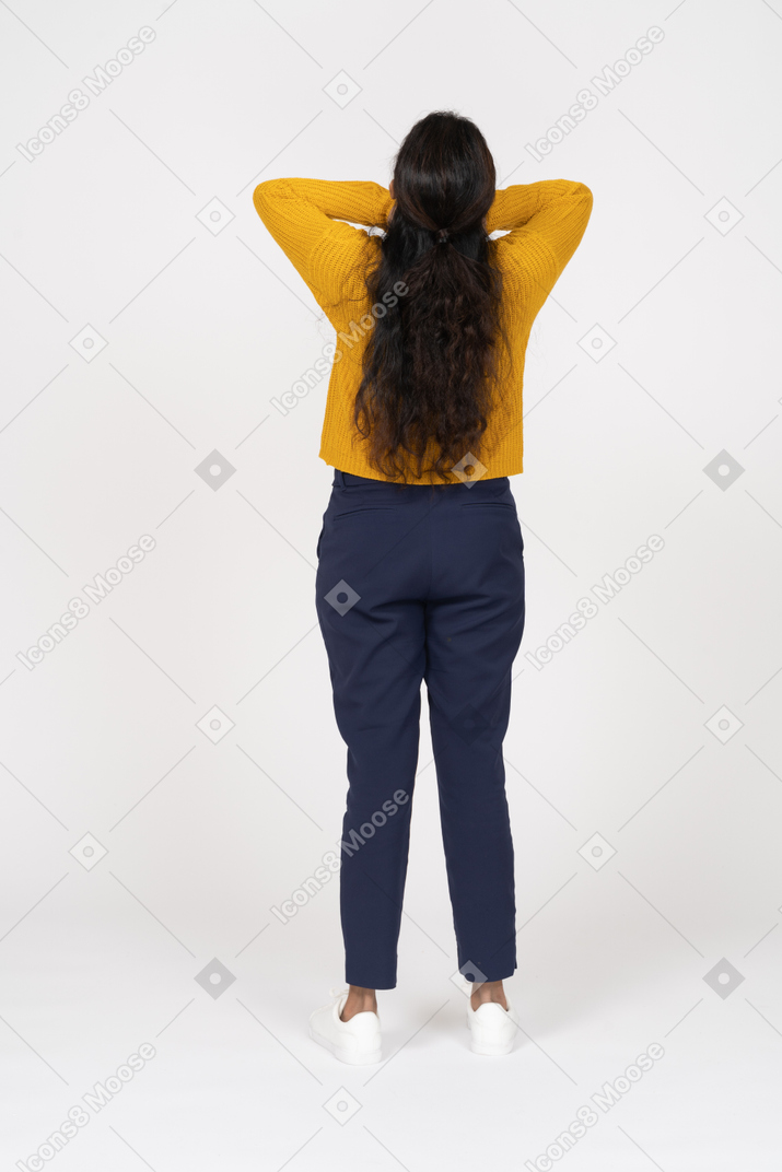 Rear view of a girl in casual clothes posing with hands on neck