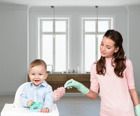 Woman tidying next to a baby in high chair