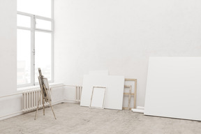 Art studio with an easel and blank canvases