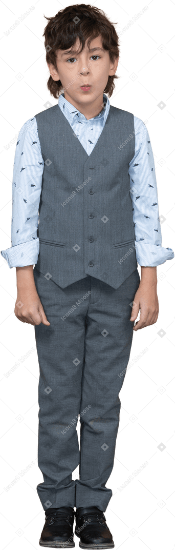 Front view of a cute boy in suit looking at camera