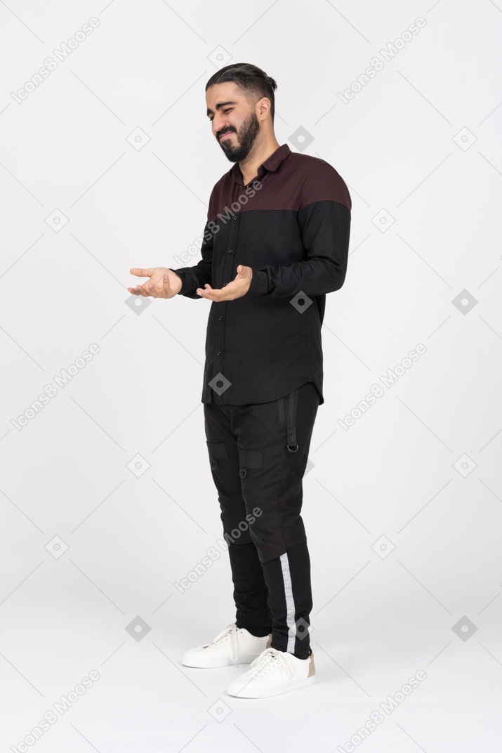 Man showing regret and holding hands out