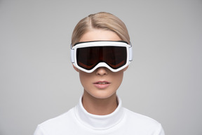 Close-up of a young blonde woman in ski goggles