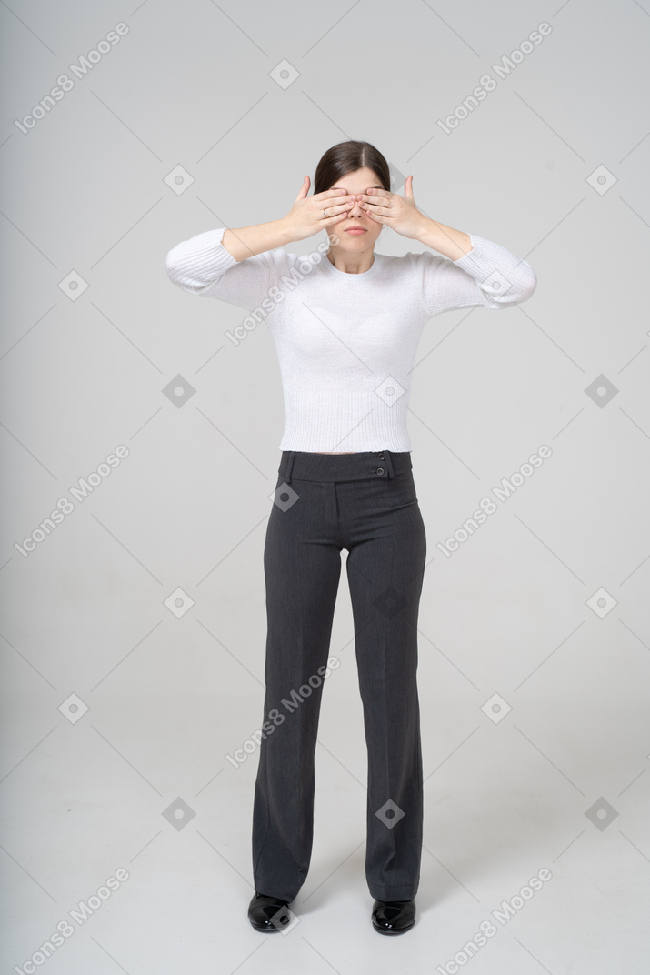 Woman covering eyes with hands