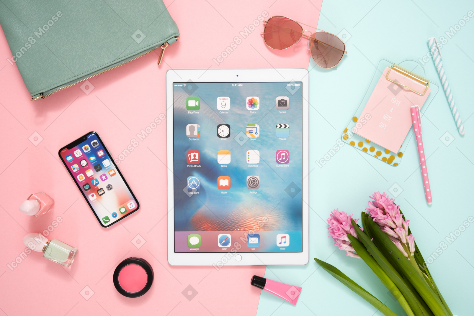 Desk of a modern woman: trendy devices, cosmetics, flowers