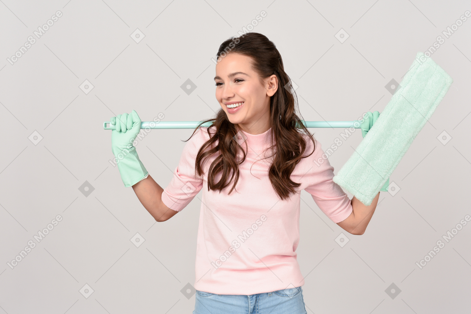 Attractive young woman holding a mop