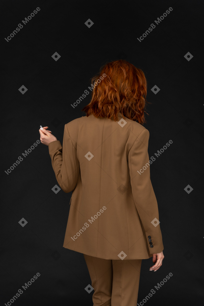 Back view of a woman in a suit