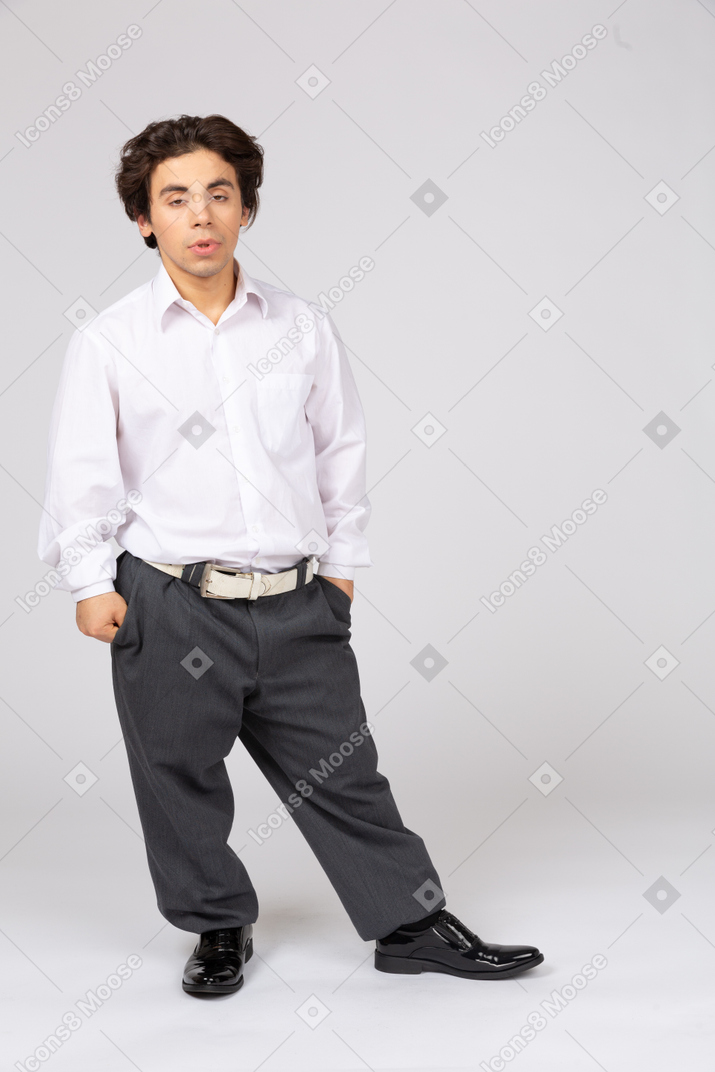 Relaxed young man leaning on one leg