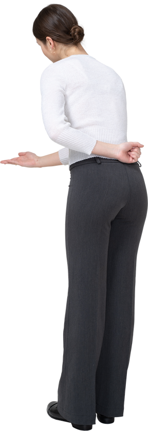 Rear view of a woman in suit gesturing