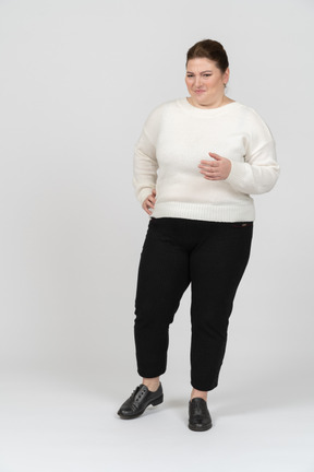 Happy plump woman in casual clothes