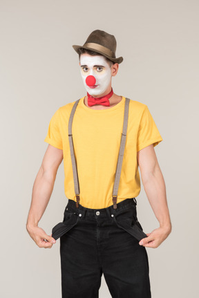 Male clown showing empty pockets