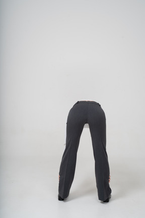 Back view of a woman bending down