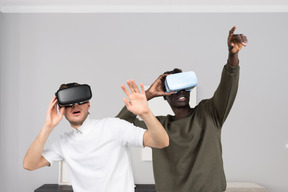 Two men with vr headsets standing next to each other