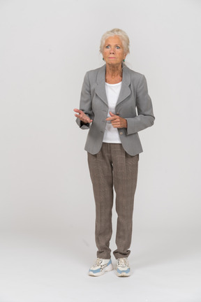 Front view of a serious old lady in suit