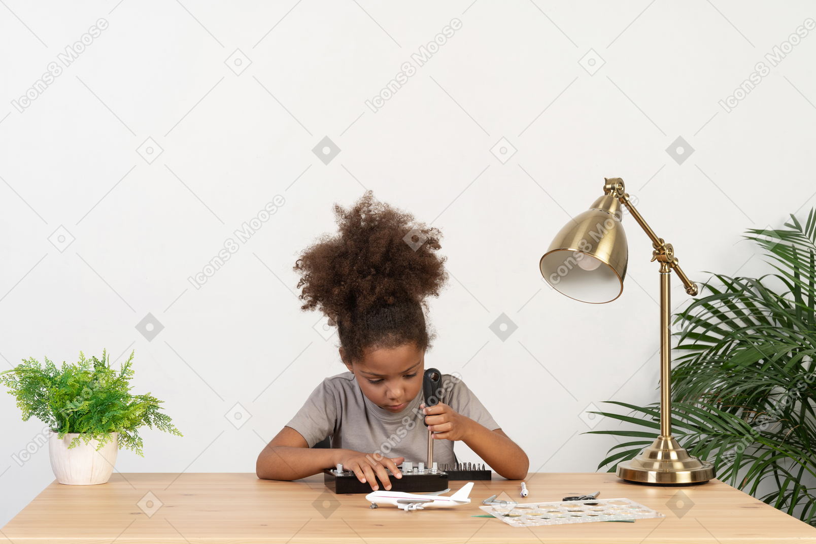 Cute girl trying to repair an device