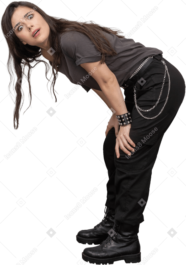 Side view of a questioning female rocker bending down