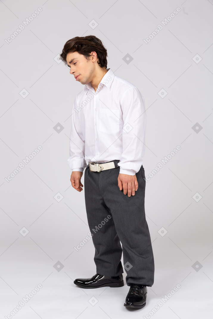 Three-quarter view of a pensive man in business casual clothes