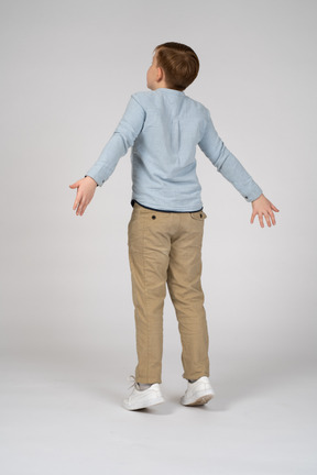 Back view of a boy jumping