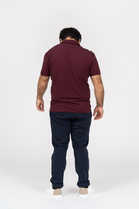 Back view of man looking down