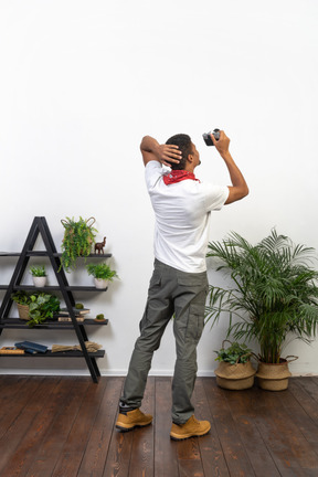 Good looking young man with a camera