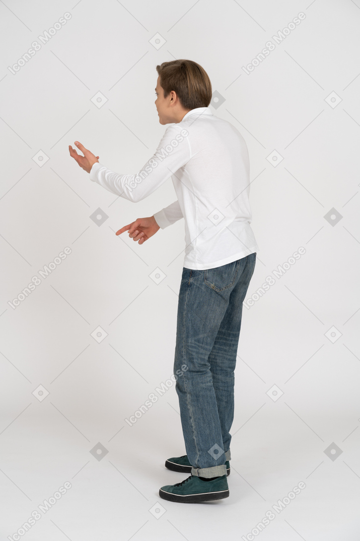 Young man in casual clothes standing