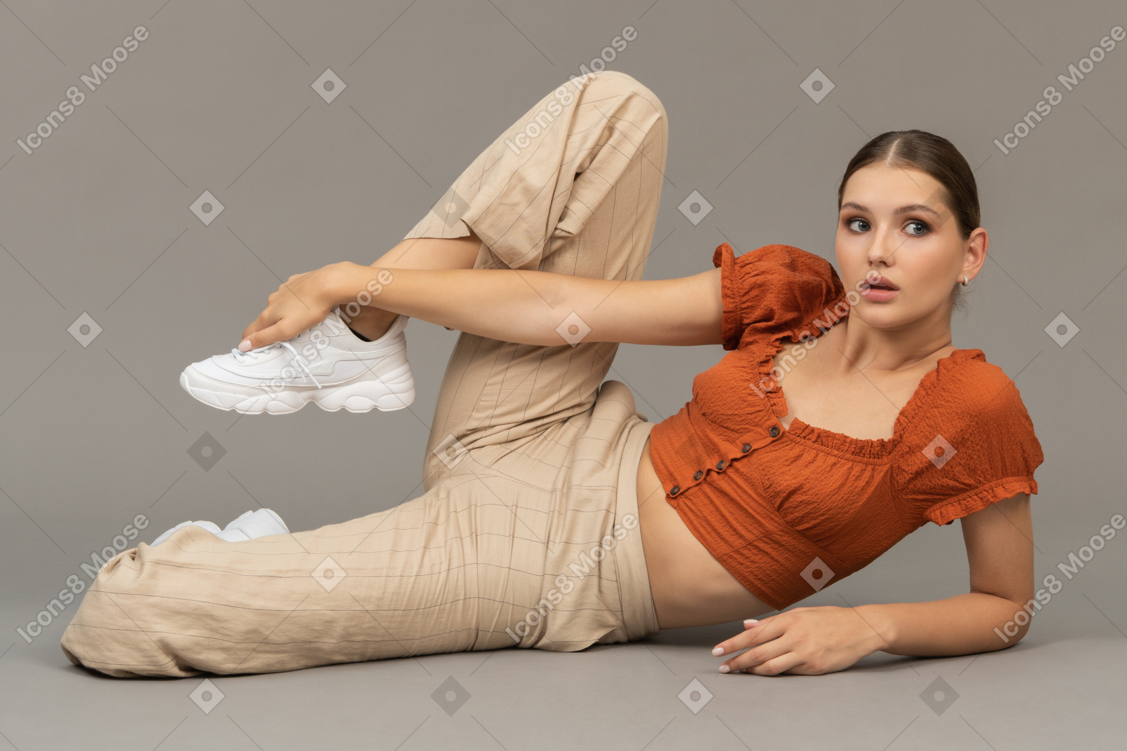 Young woman holding her leg