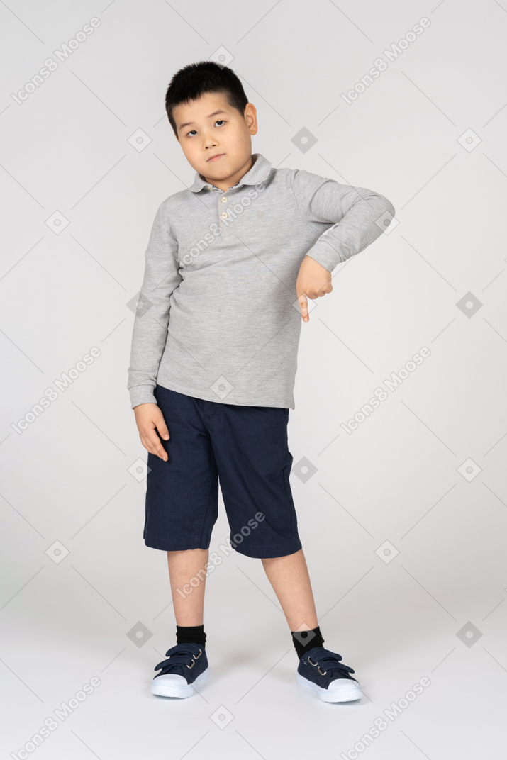 Little boy pointing down