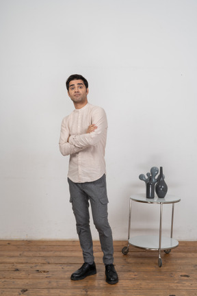 Confident man in shirt standing in front of camera